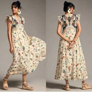 Anthropologie maxi dress with embroidered bodice and flutter sleeves.